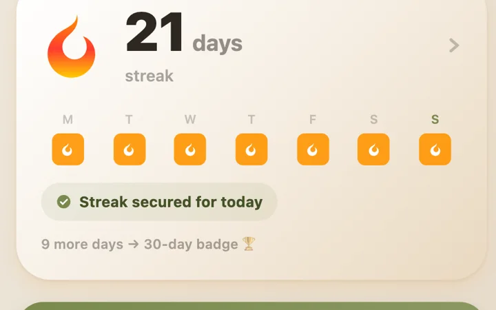 Dialect streak card: 21-day streak, row of daily flames and “Streak secured” label